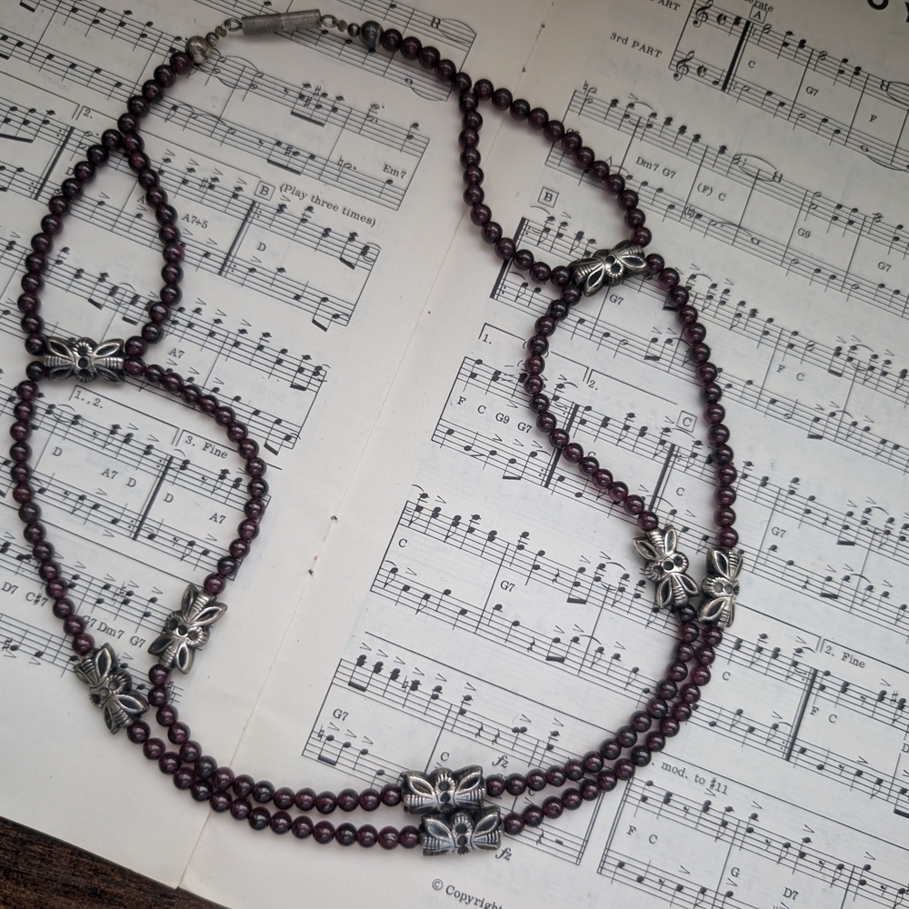 Elegant Beaded Necklace with Butterfly Accents